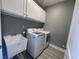 Functional laundry room featuring modern appliances, sink, and ample cabinet space at 1519 Wood Stork Dr., Conway, SC 29526