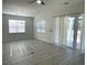 Bright living room with French doors, recessed lighting, and large windows with white blinds at 1519 Wood Stork Dr., Conway, SC 29526