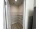 Pantry with white wire shelving and gray plank flooring, conveniently located next to the kitchen at 1519 Wood Stork Dr., Conway, SC 29526