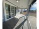 Inviting screened-in porch with ceiling fan and tiled floor adjacent to sliding glass door at 1519 Wood Stork Dr., Conway, SC 29526