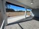 Inviting screened-in porch with ceiling fan and tiled floor, perfect for outdoor relaxation at 1519 Wood Stork Dr., Conway, SC 29526