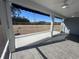 Inviting screened-in porch with ceiling fan and tiled floor, perfect for outdoor relaxation at 1519 Wood Stork Dr., Conway, SC 29526