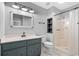 Bathroom with gray vanity, shower, and white toilet at 1600 Gibson Ave., Myrtle Beach, SC 29575