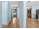 Hallway with light blue walls and wood-look floors at 1600 Gibson Ave., Myrtle Beach, SC 29575