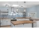 Modern kitchen featuring butcher block countertops, stainless steel appliances, and white cabinets at 1600 Gibson Ave., Myrtle Beach, SC 29575