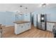 Updated kitchen boasting a large island, stainless steel refrigerator, and light wood floors at 1600 Gibson Ave., Myrtle Beach, SC 29575