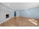 Spacious living room with hardwood floors and a white brick fireplace at 1600 Gibson Ave., Myrtle Beach, SC 29575
