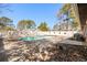 Inviting backyard swimming pool with surrounding trees at 1600 Gibson Ave., Myrtle Beach, SC 29575