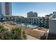 Aerial view of a hotel with pool and parking at 1600 S Ocean Blvd. # 214, Myrtle Beach, SC 29577