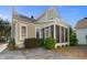 Side view of house showcasing screened porch and landscaping at 171 Beaufain Ct., Pawleys Island, SC 29585