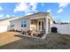 Private backyard with patio, grill, and landscaping at 191 Ocean Commons Dr., Surfside Beach, SC 29575