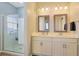 Double vanity bathroom with glass shower at 191 Ocean Commons Dr., Surfside Beach, SC 29575