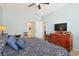 King-size bed, dresser, and TV in bright bedroom at 191 Ocean Commons Dr., Surfside Beach, SC 29575
