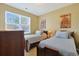 Bedroom with two twin beds and window at 191 Ocean Commons Dr., Surfside Beach, SC 29575