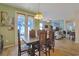 Bright dining room with access to the patio and living room at 191 Ocean Commons Dr., Surfside Beach, SC 29575