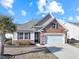 Charming one-story home with stone accents and a two-car garage at 191 Ocean Commons Dr., Surfside Beach, SC 29575