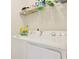 Convenient laundry room with washer, dryer, and shelving at 191 Ocean Commons Dr., Surfside Beach, SC 29575
