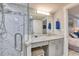 Modern bathroom with granite vanity and walk-in shower at 1990 N Waccamaw Dr. # 1109, Garden City Beach, SC 29576
