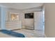 Bedroom with large dresser, TV and ensuite bathroom at 1990 N Waccamaw Dr. # 1109, Garden City Beach, SC 29576