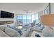 Spacious living room with ocean view and comfy seating at 1990 N Waccamaw Dr. # 1109, Garden City Beach, SC 29576