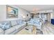 Bright living room with comfy sofas and ocean view at 1990 N Waccamaw Dr. # 1109, Garden City Beach, SC 29576