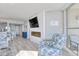 Living room with fireplace and access to balcony at 1990 N Waccamaw Dr. # 1109, Garden City Beach, SC 29576
