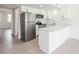 Modern white kitchen with stainless steel appliances and quartz countertops at 200 Deer Creek Rd. # G, Myrtle Beach, SC 29575