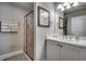 Bathroom features a tiled walk-in shower and marble countertops with double sinks at 2004 Via Palma Dr., North Myrtle Beach, SC 29582