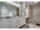 Bright bathroom featuring double sinks with white cabinetry and a makeup vanity at 2004 Via Palma Dr., North Myrtle Beach, SC 29582