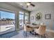 Bright dining area featuring a round table, four chairs, and sliding glass doors to the outdoor patio at 2004 Via Palma Dr., North Myrtle Beach, SC 29582