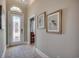 Welcoming foyer with decorative glass door, light-colored walls, and stylish rug at 2004 Via Palma Dr., North Myrtle Beach, SC 29582