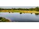 Beautiful golf course with lush green fairways and a tranquil lake at 2004 Via Palma Dr., North Myrtle Beach, SC 29582