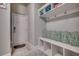 Charming mud room features built-in storage, seating, and convenient hooks at 2004 Via Palma Dr., North Myrtle Beach, SC 29582