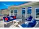 Lounge on the patio with a comfortable couch and chairs, perfect for relaxing outdoors at 2004 Via Palma Dr., North Myrtle Beach, SC 29582