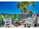 Relax on this backyard patio, complete with an outdoor firepit and views of the golf course at 2004 Via Palma Dr., North Myrtle Beach, SC 29582