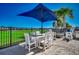 Enjoy outdoor dining on the patio with a table for six, firepit, and views of the golf course at 2004 Via Palma Dr., North Myrtle Beach, SC 29582