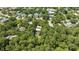 Aerial view showcasing home's location in a wooded neighborhood at 245 Windover Dr., Pawleys Island, SC 29585