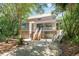 Two-story home with brick and siding exterior, a covered porch, and a landscaped yard at 245 Windover Dr., Pawleys Island, SC 29585