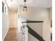 Upstairs hallway with wood floors and a small desk at 245 Windover Dr., Pawleys Island, SC 29585
