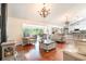 Open living room with hardwood floors, comfortable seating, and a wood-burning stove at 245 Windover Dr., Pawleys Island, SC 29585