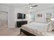 Bright bedroom with large TV, dresser, and access to bathroom and closet at 2557 Pete Dye Dr. # 903, North Myrtle Beach, SC 29582