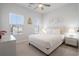 Bright bedroom with a queen bed and ceiling fan at 2557 Pete Dye Dr. # 903, North Myrtle Beach, SC 29582