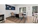 Elegant dining area with dark wood table and access to back deck at 2557 Pete Dye Dr. # 903, North Myrtle Beach, SC 29582