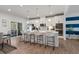 Modern kitchen with white cabinets, large island, and breakfast bar at 2557 Pete Dye Dr. # 903, North Myrtle Beach, SC 29582
