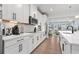 White kitchen with stainless appliances and quartz countertops at 2557 Pete Dye Dr. # 903, North Myrtle Beach, SC 29582