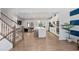 Modern kitchen with white cabinets, island, and stainless appliances at 2557 Pete Dye Dr. # 903, North Myrtle Beach, SC 29582