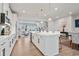 Modern kitchen with white cabinets, island, and stainless steel appliances at 2557 Pete Dye Dr. # 903, North Myrtle Beach, SC 29582