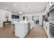 Open concept kitchen with white cabinetry, large island, and hardwood floors at 2557 Pete Dye Dr. # 903, North Myrtle Beach, SC 29582