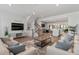 Open concept living room with kitchen and staircase views at 2557 Pete Dye Dr. # 903, North Myrtle Beach, SC 29582