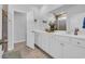 Double vanity bathroom with a large mirror and modern fixtures at 299 Empyrean Circle, Myrtle Beach, SC 29588